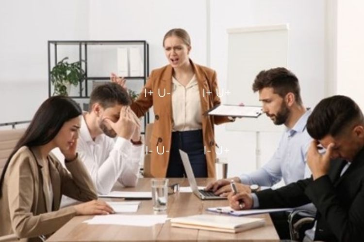 leader shouting at team who look unhappy